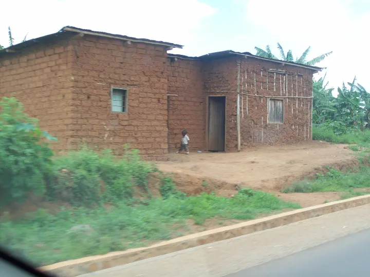 A housing scene in Bugesera near a local road.